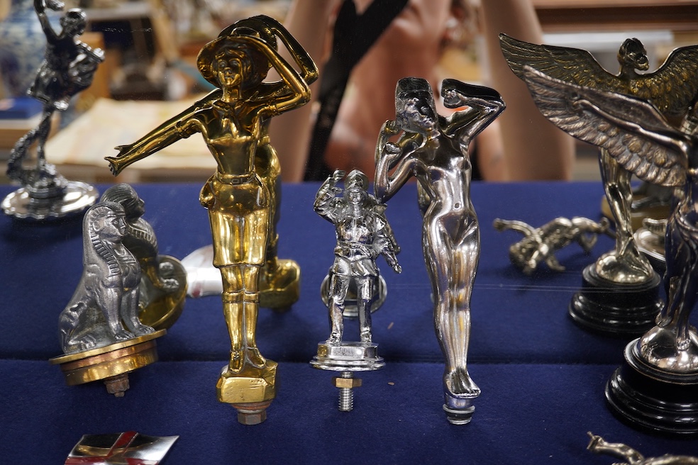 Eight figural chrome and brass car mascots, etc. including a knight in full armour mounted on a threaded radiator cap, a sphinx mounted on a threaded radiator cap, plus an additional sphinx mounted on an alabaster plinth
